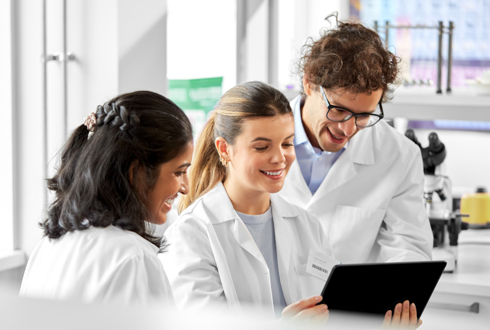 Scientists gathered around an iPad