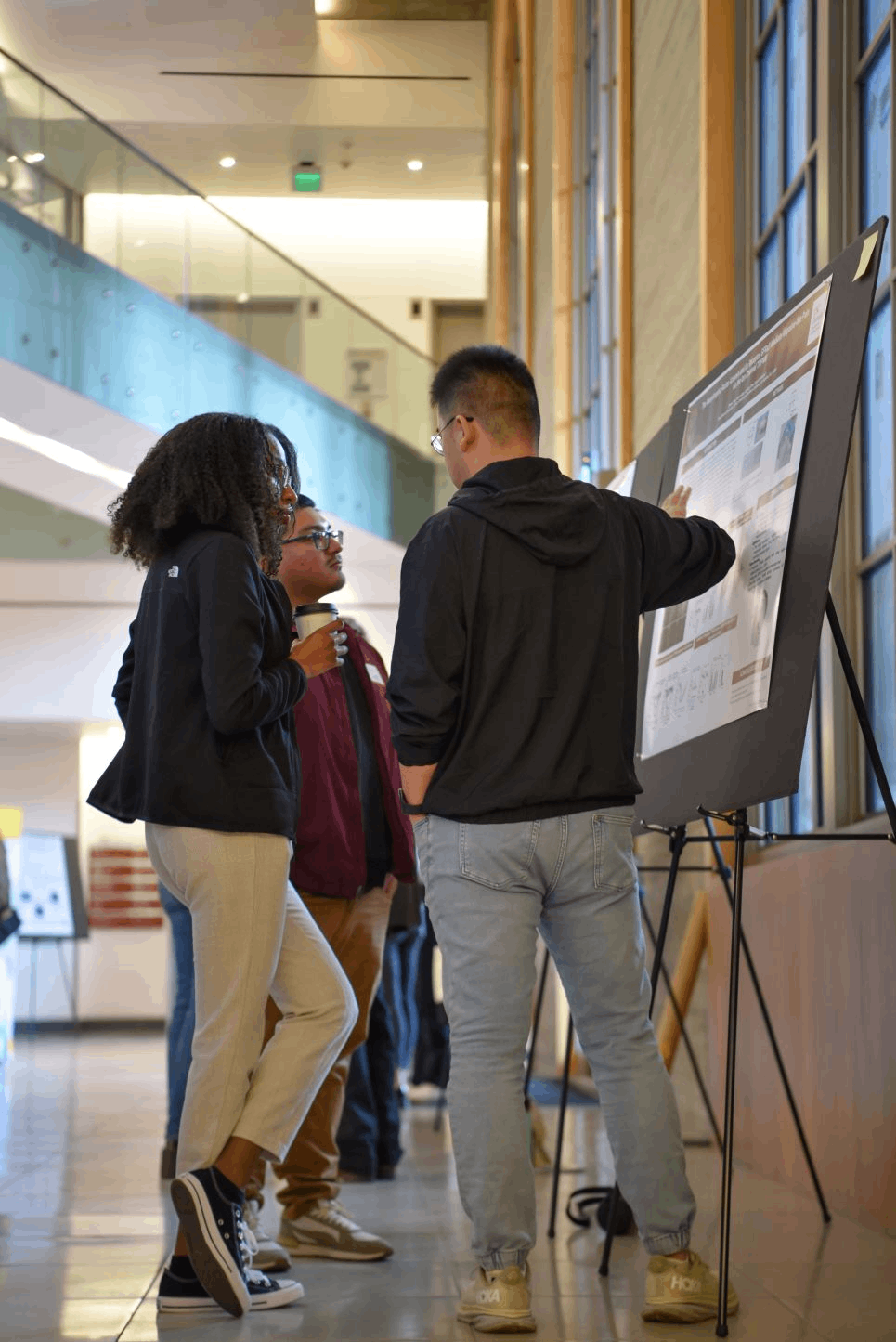 A person is presenting their poster