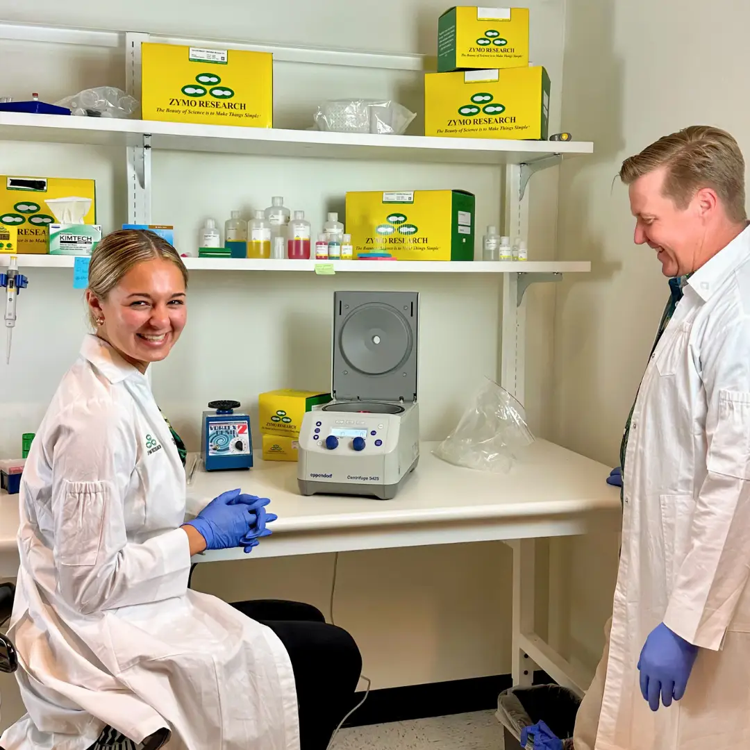 Two person in lab coat in Zymo lab