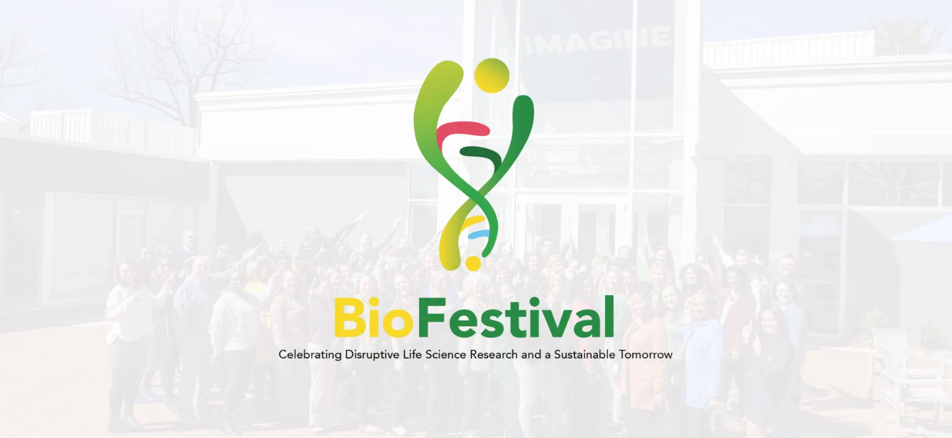 Logo and banner for BioFestival, featuring two stylized abstract figures forming a DNA double helix shape in green, red, yellow, and blue. Behind the logo is a faded background of a group of people gathered in front of the Imagine Center at Johns Hopkins University. Below the festival name is the tagline: 'Celebrating Disruptive Life Science Research and a Sustainable Tomorrow.'